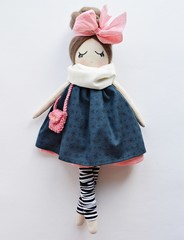 Heirloom textile doll with pink bow wearing navy blue dress, striped gaiters, cute knitted handbag...