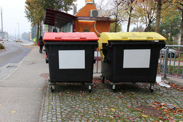 Black plastic trash containers, residential area new building.