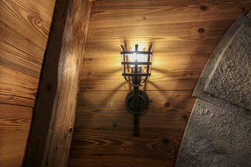 The lamp on the brown wooden in a mine .