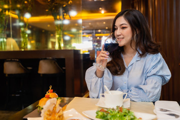 woman drinking wine in the restaurant