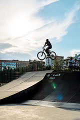 BMX stunt vertical. A professional cyclist Extreme cycling concept. Dert jump. BMX vertical barspin jump. BMX Freestyle Vert Stunt. Halframp. Set Of Skatepark Element