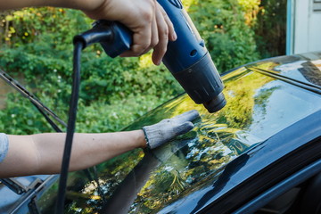 Car Films Installing windshield protection film blur.;