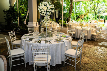 Elegant outdoors summer wedding with flowers decoration and mirrors