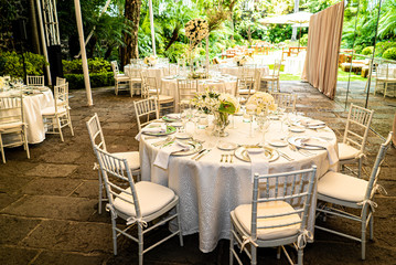 Elegant outdoors summer wedding with flowers decoration and mirrors