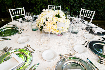 Elegant outdoors summer wedding with flowers decoration and mirrors