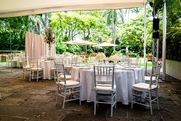 Elegant outdoors summer wedding with flowers decoration and mirrors