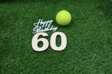 Tennis 60th Birthday Anniversary with tennis ball and number 60th on green grass