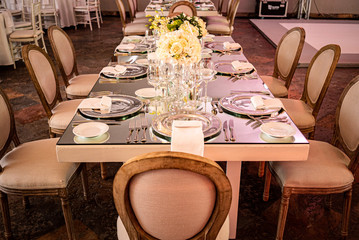Elegant outdoors summer wedding with flowers decoration and mirrors