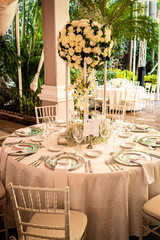 Elegant outdoors summer wedding with flowers decoration and mirrors