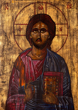 Byzantine or orthodox style icon of Jesus Christ blessing and holding the bible.