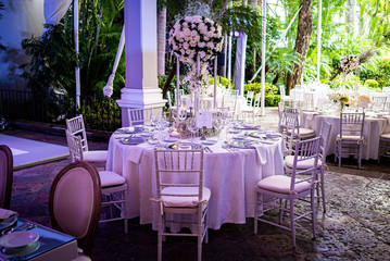 Elegant outdoors summer wedding with flowers decoration and mirrors