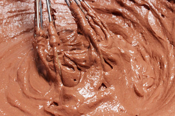 Hand whipping a chocolate mixture for a dessert