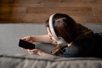 woman listening to music on mobile phone