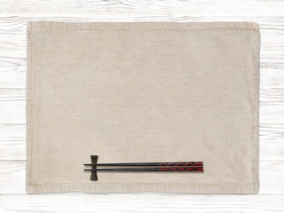 Chopsticks placed on a placemat