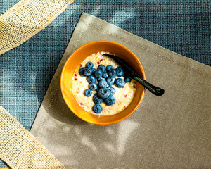 Oatmeal with different berries. healthy breakfast steel cut oatmeal porridge with blueberry blackberry. Porridge and blueberries