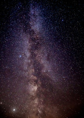 Fototapeta na wymiar Vertical Milky Way on a farmland 