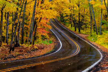 Highway 41 covered roadway in autumn near Copper Harbor in the Upper Peninsula of Michigan, USA