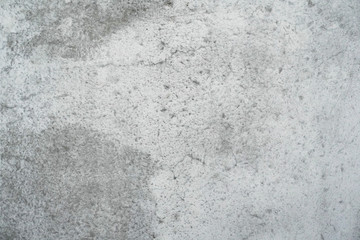 Texture of a smooth gray concrete wall as background or wallpaper. Close up of concrete wall with rough texture. Cement texture.