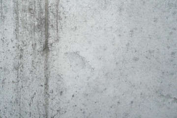 Texture of a smooth gray concrete wall as background or wallpaper. Close up of concrete wall with rough texture. Cement texture.