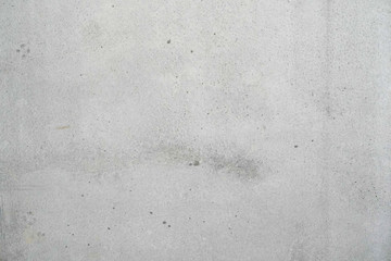Texture of a smooth gray concrete wall as background or wallpaper. Close up of concrete wall with rough texture. Cement texture.