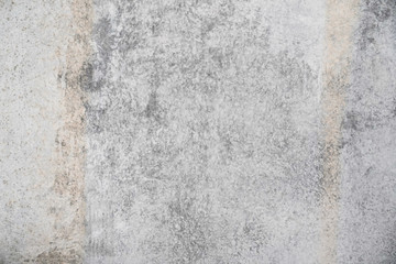 Fototapeta na wymiar Texture of a smooth gray concrete wall as background or wallpaper. Close up of concrete wall with rough texture. Cement texture.