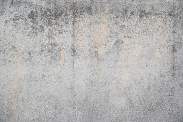 Texture of a smooth gray concrete wall as background or wallpaper. Close up of concrete wall with rough texture. Cement texture.