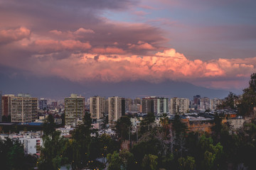 Panoramic view of beautiful cloudscape and sunset sky over Santiago skyline and The Andes Mountains, Chile