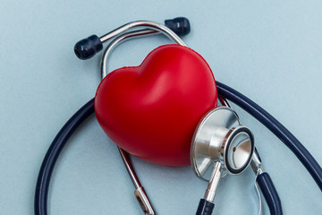 Red heart with heartbeat or heart rate and stethoscope on blue background. Medical and Health care,...