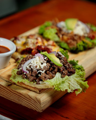 three meat and cheese tacos