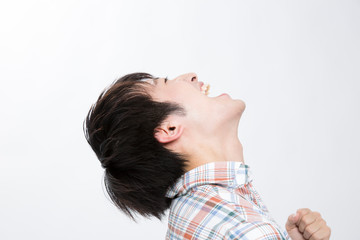 Fototapeta premium ガッツポーズをする男性の横顔