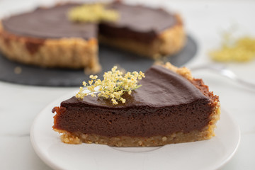 sweet home made chocolate elderflower cake on a table