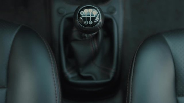 Women's shifting gears on a manual transmission.