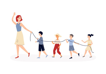 Kindergarten children walking behind teacher with safety rope.