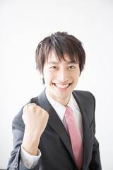 ガッツポーズをするビジネスマン