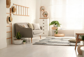 Stylish living room interior with comfortable sofa