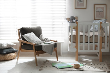 Baby room interior with crib and armchair. Idea for design