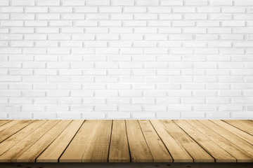 Empty wooden table top on white brick wall background, Design wood terrace white. Perspective for show space for your copy and branding. Can be used as product display montage. Vintage style concept.