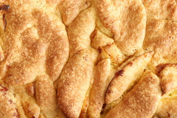Homemade apple pie with a delicious crust. Charlotte pie. Baking background. View from above.