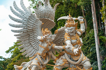 Fighting the statues of the gods of Hindu religion and mythology. The Park is in the background