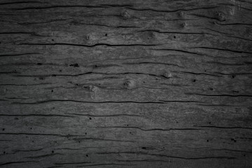 Grunge dark old wood texture background. Vintage black wooden board wall antique cracking old style background objects for furniture design. Painted weathered peeling table wood hardwood decoration.