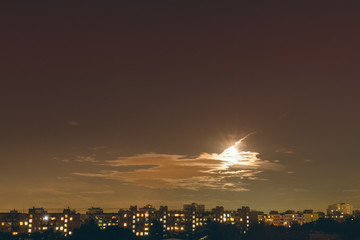 Sunset and full moon over the city © andrey_iv