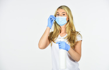 Personal hygiene. Cleaning and Disinfection. Serious hygiene. Disinfection concept. Girl clean frequently touched surfaces. Wearing mask protect from coronavirus. Risk being exposed coronavirus