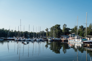 Fototapeta na wymiar Row of yachts anchored in harbour of a European city