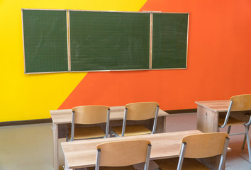 An empty school classroom with a blackboard. Interior of a school classroom