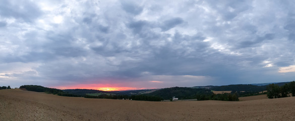 scenic panorama view of natural landscape under a cloudy sky