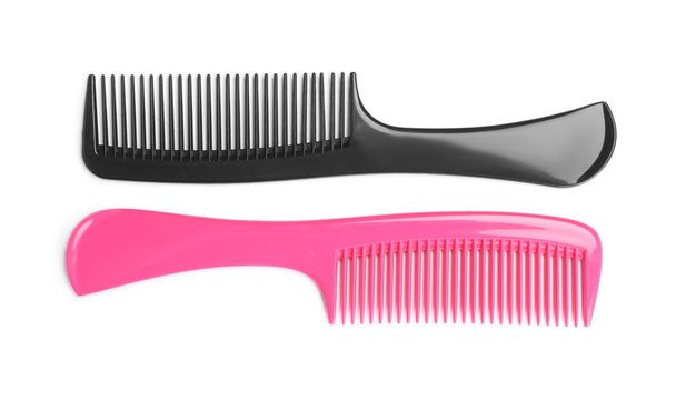 Modern hair combs isolated on white, top view