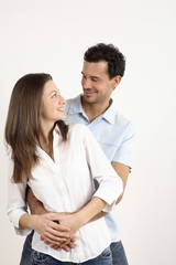 Man hugging woman from behind