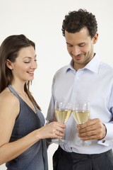 Man and woman toasting with champagne