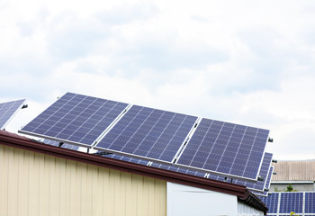 Fototapeta premium House with installed solar panels on roof. Alternative energy source