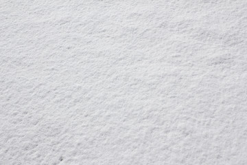 Fototapeta premium Texture of fresh snow covering the ground in winter .